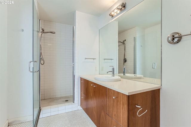 bathroom featuring walk in shower, tile patterned flooring, and vanity