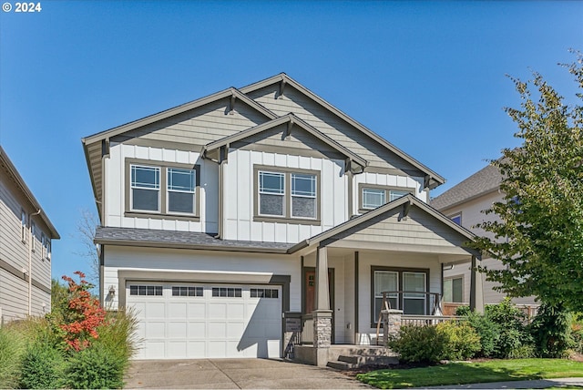 craftsman-style home featuring a garage and covered porch