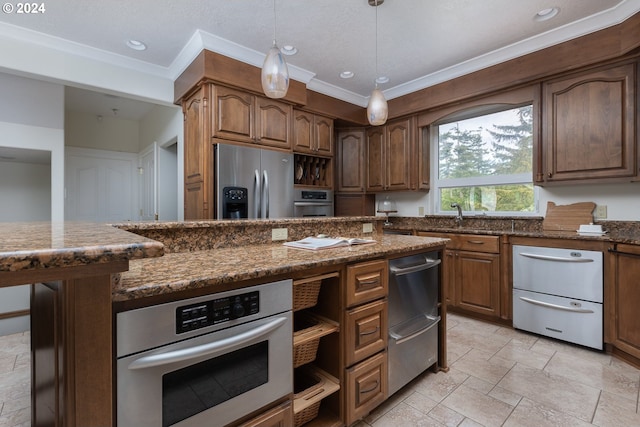 kitchen with hanging light fixtures, crown molding, appliances with stainless steel finishes, light tile patterned floors, and a center island