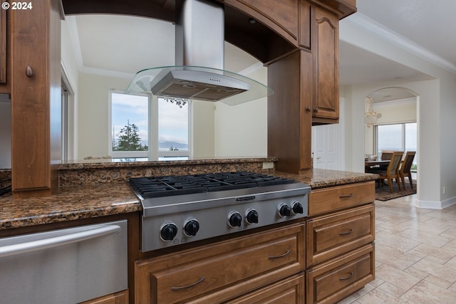 kitchen with light tile patterned flooring, stainless steel gas stovetop, plenty of natural light, and island range hood