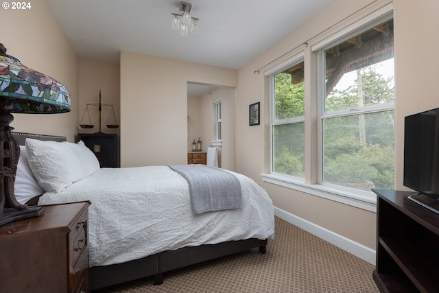 bedroom featuring light colored carpet