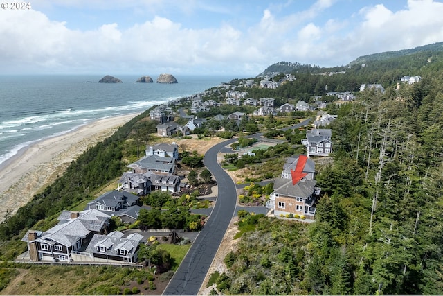 aerial view with a water view, a residential view, and a view of the beach