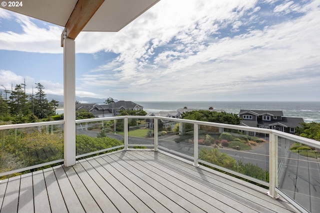 wooden deck with a water view