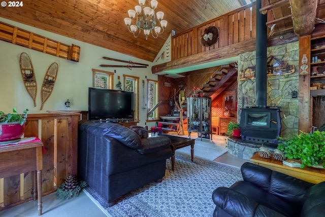 living room with high vaulted ceiling, wooden walls, wooden ceiling, a wood stove, and an inviting chandelier