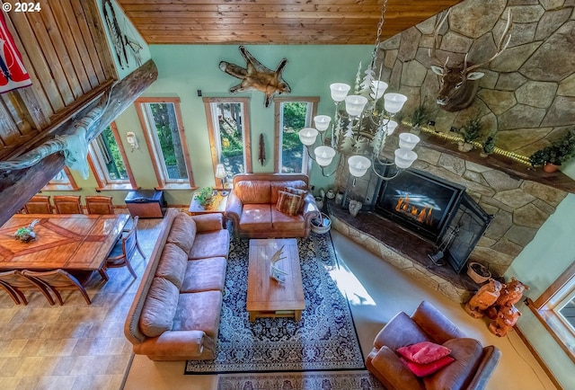 living room with wood ceiling, high vaulted ceiling, and a stone fireplace