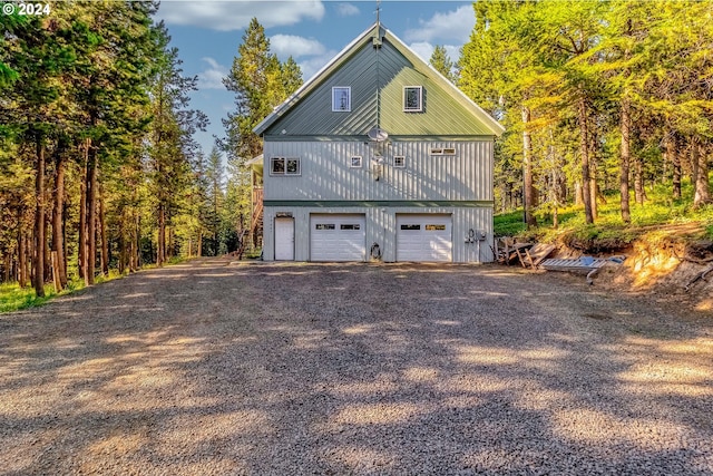 view of side of home featuring a garage