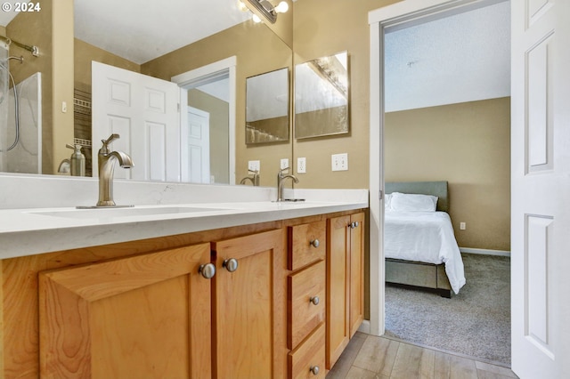 bathroom featuring vanity and hardwood / wood-style floors