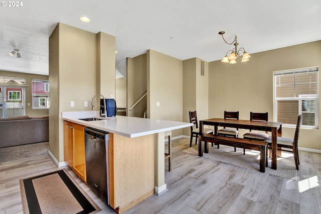 kitchen with dishwasher, light hardwood / wood-style floors, and sink