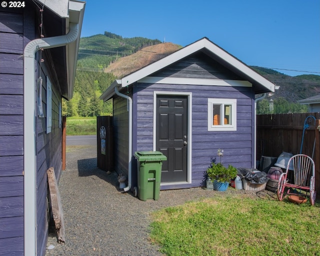 view of shed / structure with a mountain view