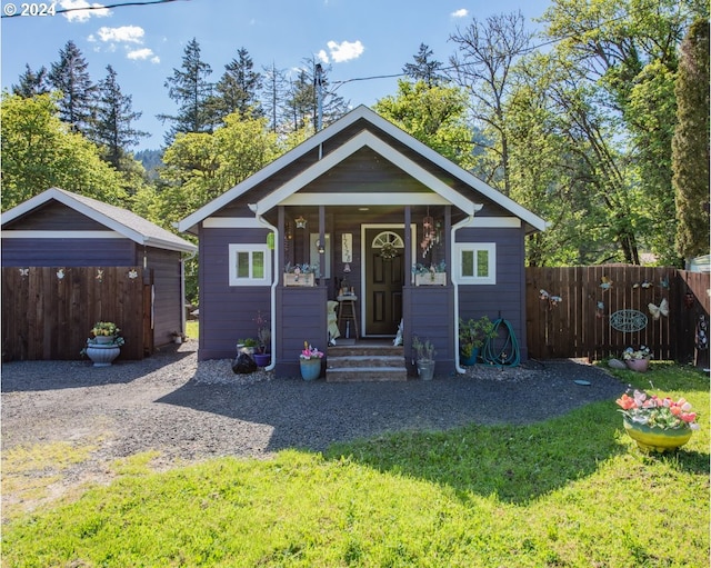 bungalow with a front lawn