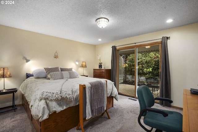 carpeted bedroom with access to outside and a textured ceiling