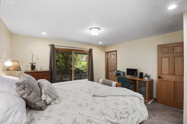 bedroom with carpet floors, access to exterior, and a textured ceiling