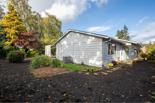 view of property exterior with central AC unit