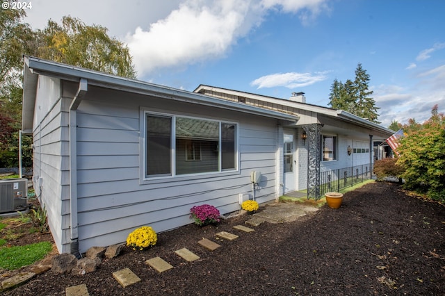 view of front of home featuring central air condition unit