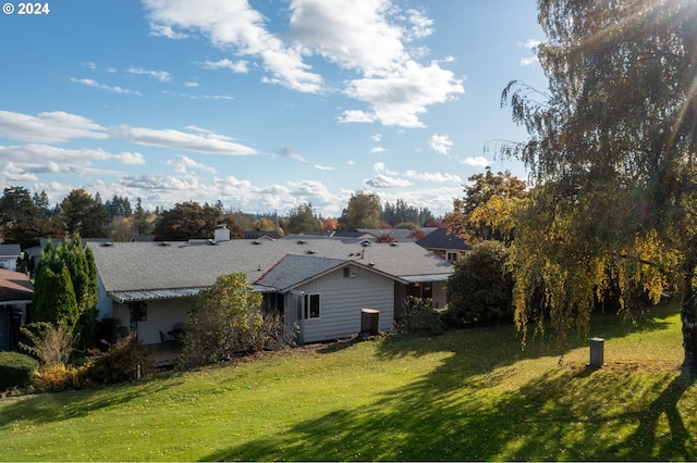 rear view of house with a lawn