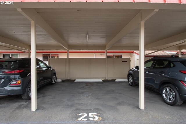 garage featuring a carport