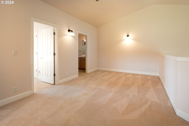 bedroom with lofted ceiling, a ceiling fan, baseboards, and light colored carpet