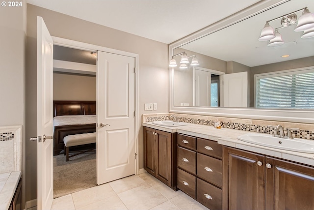 bathroom with vanity and tile patterned flooring