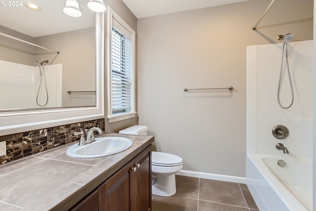 full bathroom featuring plenty of natural light, tile patterned flooring, baseboards, and backsplash