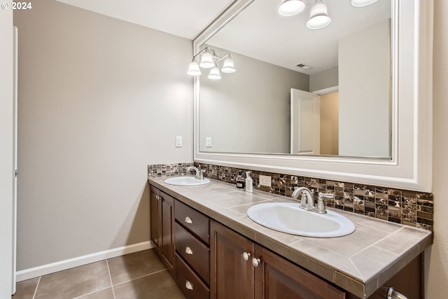 bathroom with tile patterned floors, vanity, and backsplash