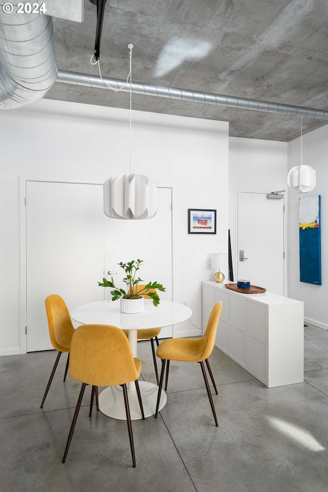 dining space with concrete floors