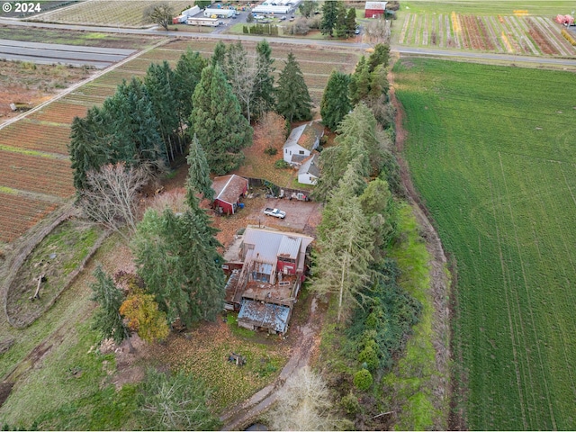 birds eye view of property with a rural view