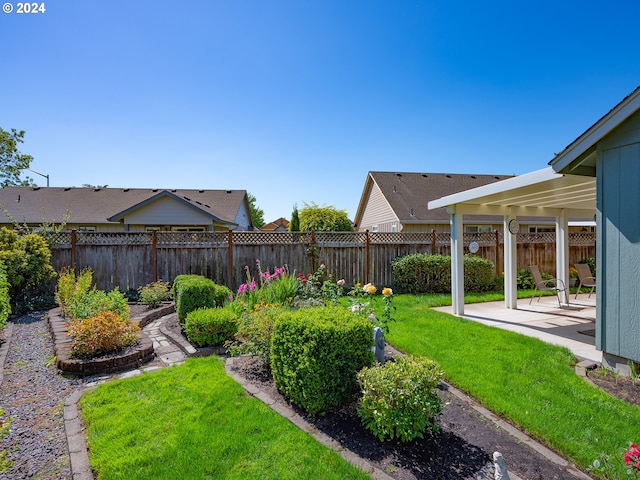 view of yard with a patio area and a fenced backyard