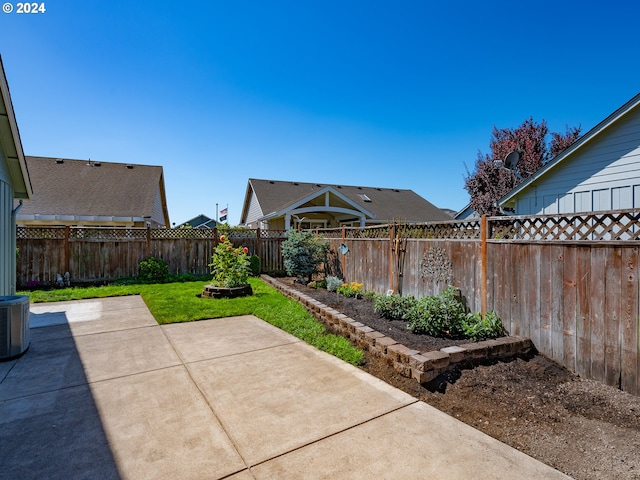 view of patio featuring a fenced backyard and central AC unit