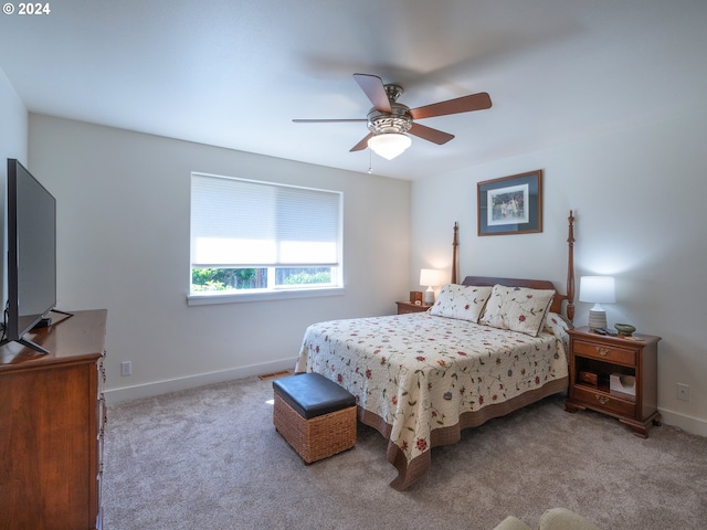 carpeted bedroom featuring a ceiling fan and baseboards