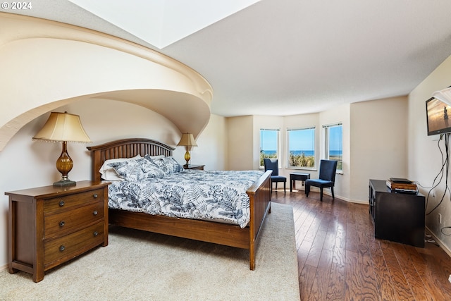 bedroom with hardwood / wood-style floors