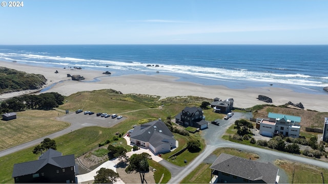 aerial view featuring a water view and a beach view