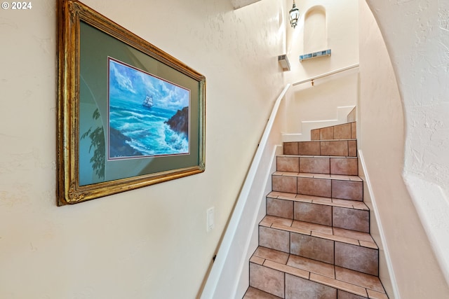 stairs with tile patterned flooring