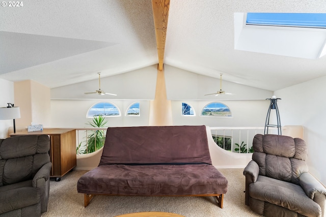 living area featuring vaulted ceiling with beams, ceiling fan, and light colored carpet