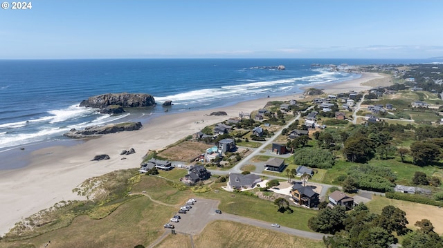 bird's eye view featuring a beach view and a water view