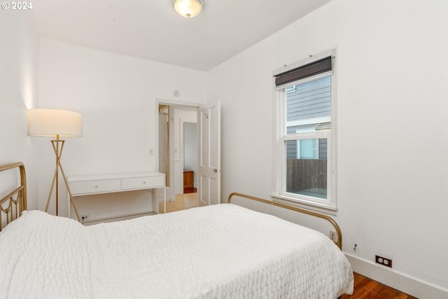 bedroom featuring wood-type flooring