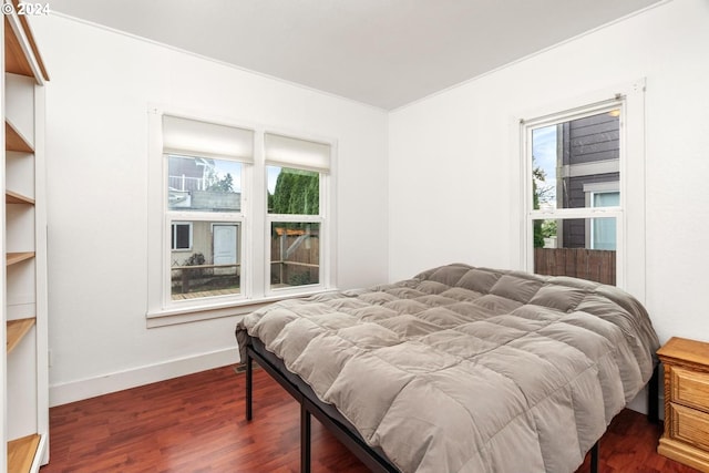 bedroom featuring dark hardwood / wood-style flooring