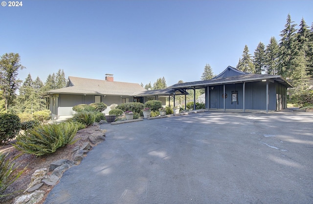 view of front of property with a carport