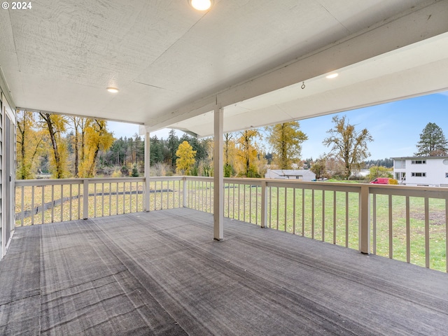 wooden deck featuring a yard