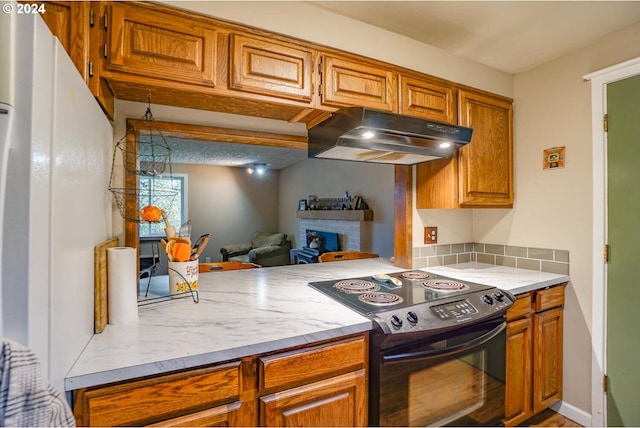 kitchen featuring black range with electric cooktop