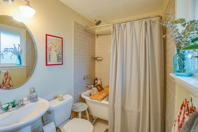 full bathroom with shower / tub combo, toilet, sink, and tile patterned flooring