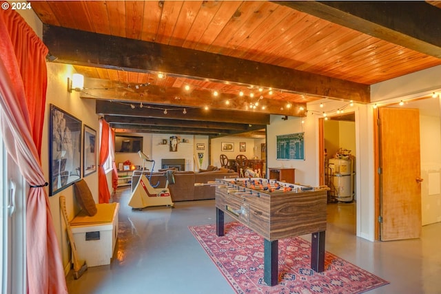 recreation room with concrete flooring, beam ceiling, wooden ceiling, and strapped water heater