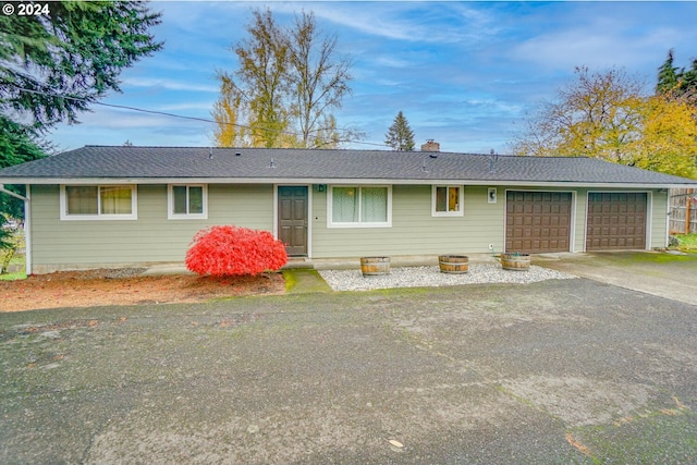 single story home with a garage