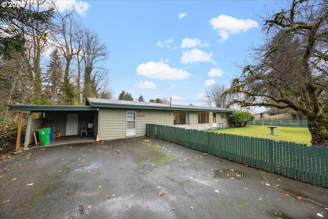 exterior space featuring a front yard and a carport