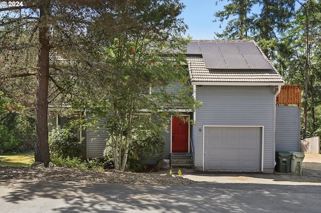 view of front of house featuring solar panels