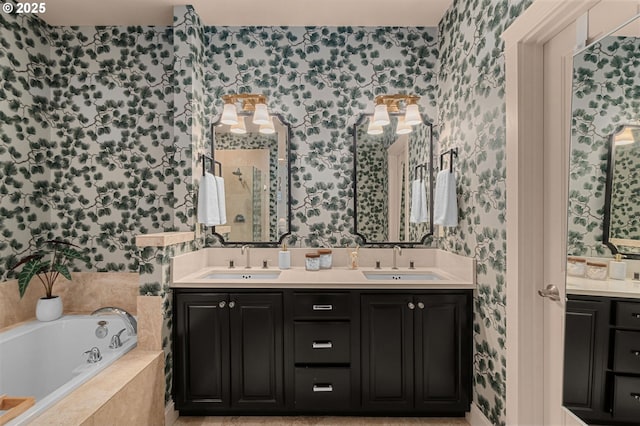 bathroom with vanity and tiled bath