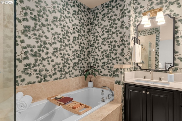 bathroom with vanity and tiled bath