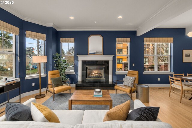 living room with ornamental molding and hardwood / wood-style flooring