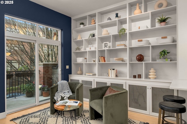 living area featuring hardwood / wood-style floors