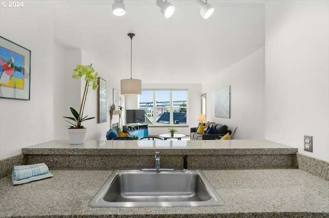 kitchen featuring sink and hanging light fixtures