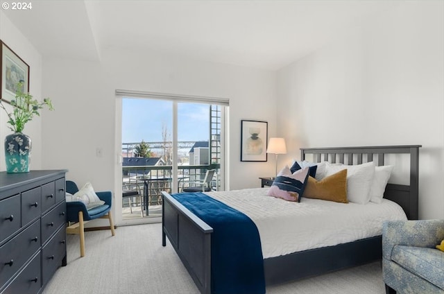 bedroom featuring access to outside and light colored carpet